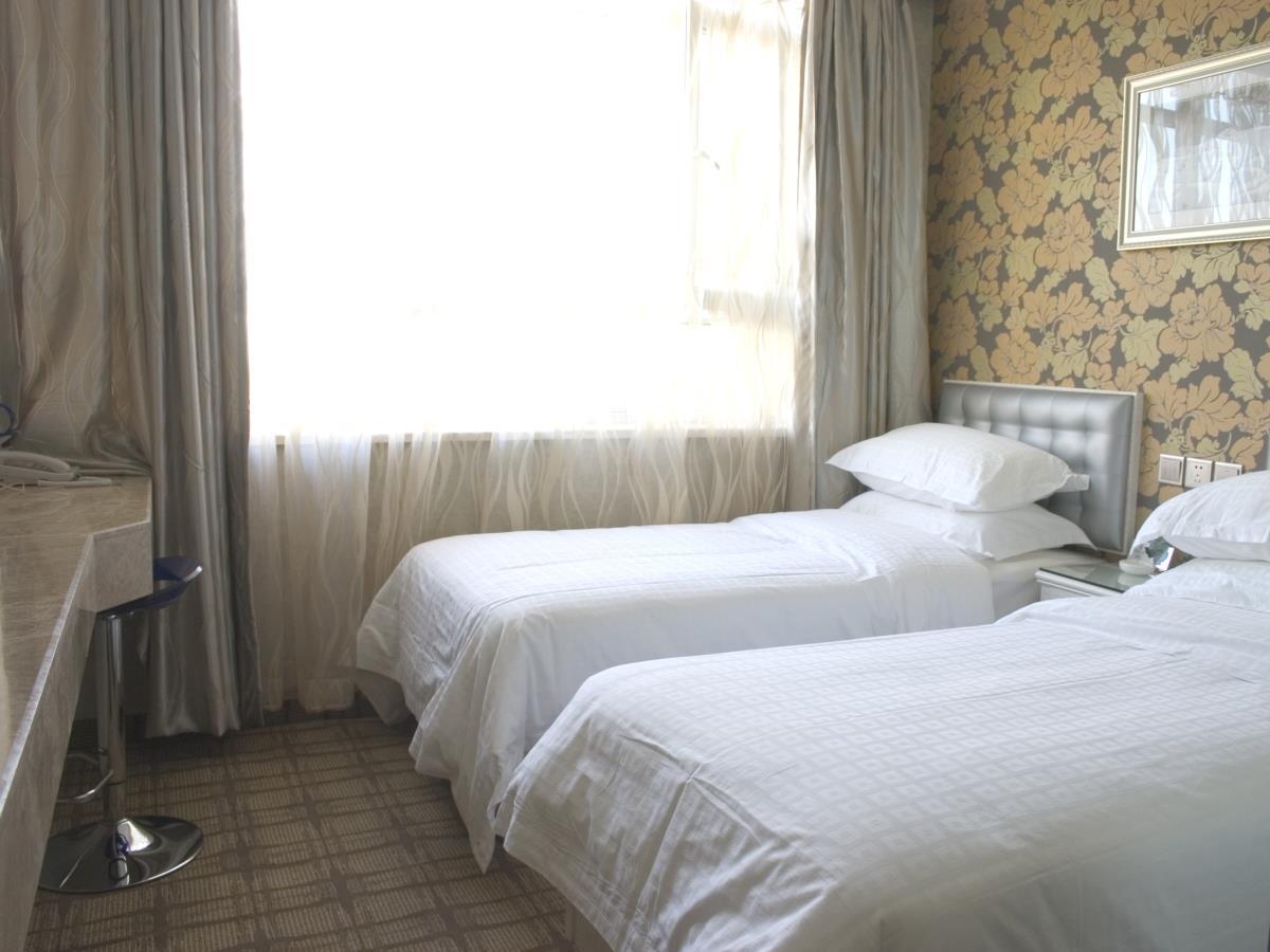 Xinyijia City Hotel Urumqi Esterno foto